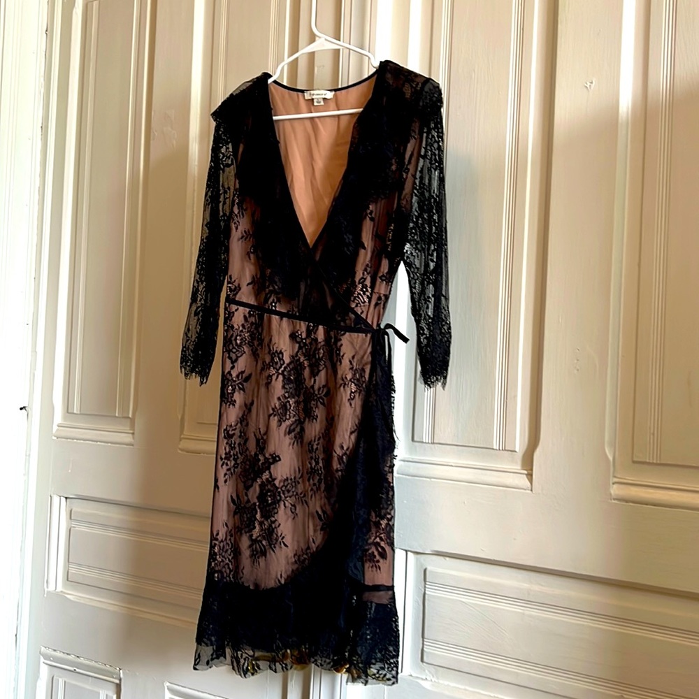 Black lace overlay on nude lining. Francesca’s, size L